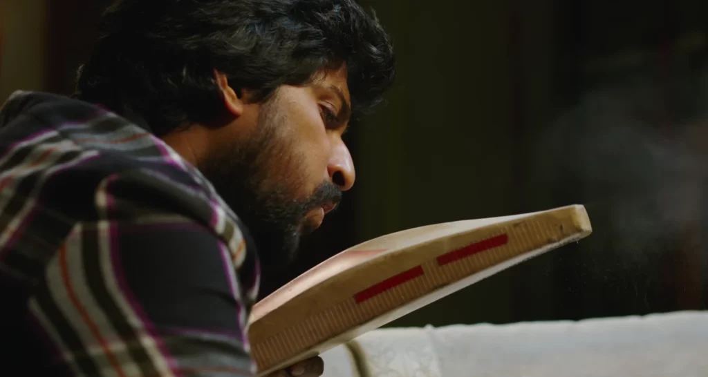 Nani blowing dust off his cricket bat in Jersey.