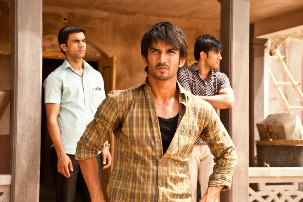 Sushant Singh Rajput, Rajkummar Rao, and Amit Sadh standing together as the three friends in Kai Po Che.