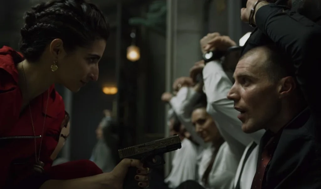 Nairobi pointing a gun at Gandia with her signature swag.