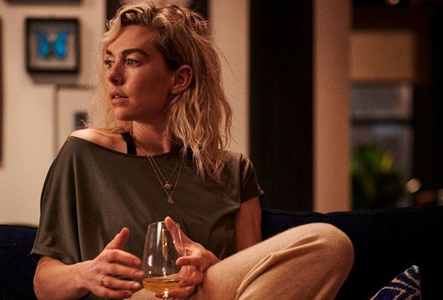Vanessa Kirby looking serious with a glass of wine, a tense scene discussed in this The Son movie review.