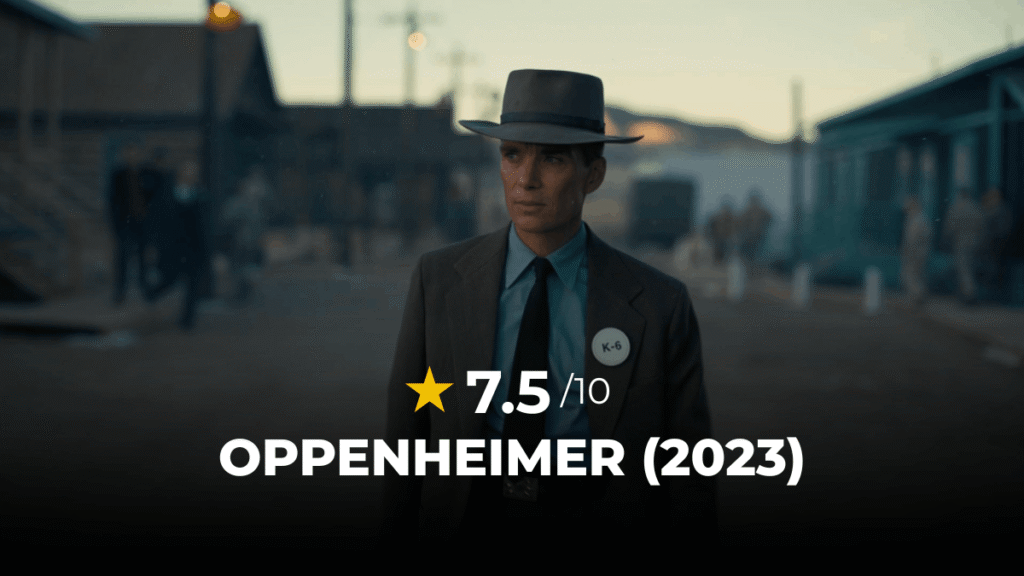 Oppenheimer review: Robert Oppenheimer wearing a suit and hat standing at the atomic bomb test site.